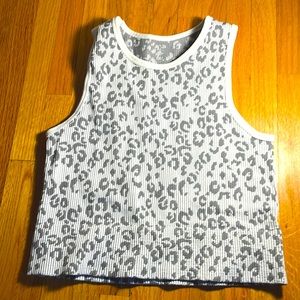 AURA cropped tank top with animal print. The size on this shirt is M/L.